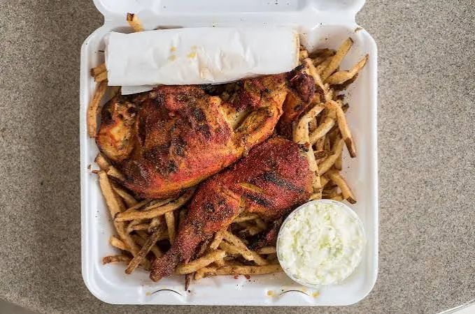 Dino's red citrus-garlic grilled chicken over fries