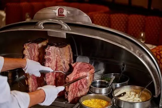 Silver carving cart with roasted prime rib at Lawry's