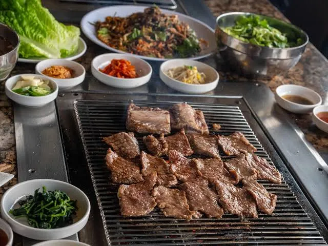 Marinated galbi charring over charcoal at Soot Bull Jip